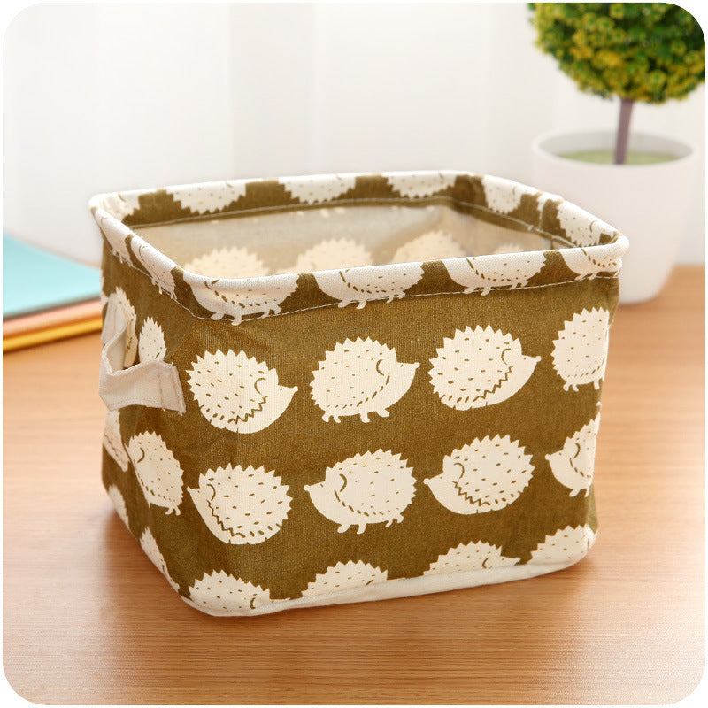 Waterproof desktop storage box made of printed cotton and linen with handle, suitable for organizing sundries.