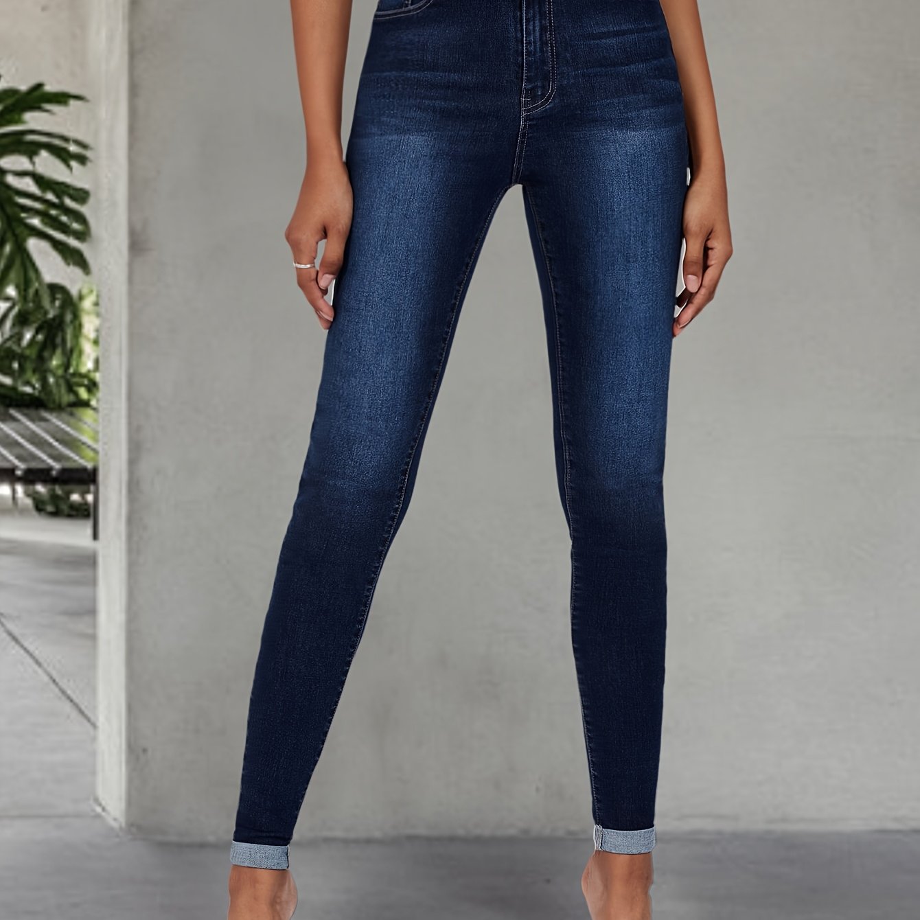 Elegant high stretch skinny jeans for women, long length with button detail, perfect for all seasons.