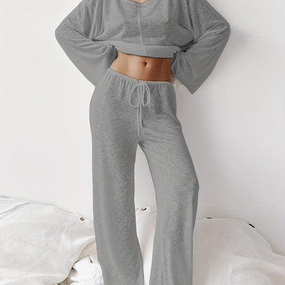 Women's two-piece set of loose and comfortable home clothes made with micro-permeable fabric, featuring round neck and long sleeves.