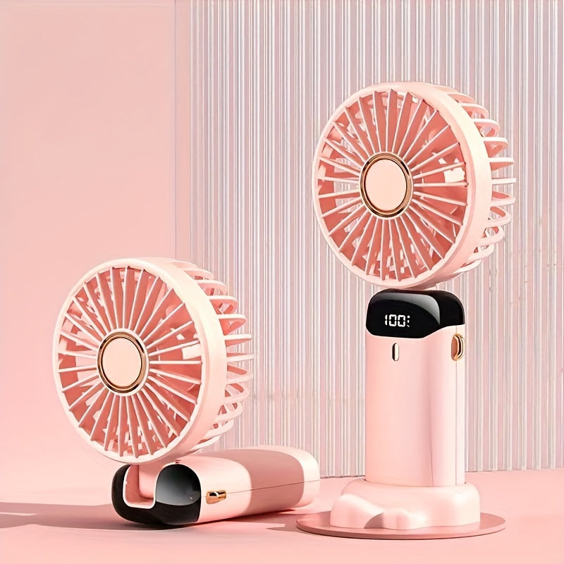 Cop Rose's Portable Mini Fan features 5-Speed Settings and an LED Display. It is USB Rechargeable with Touch Control and a Foldable Design, perfect for both indoor and outdoor use.