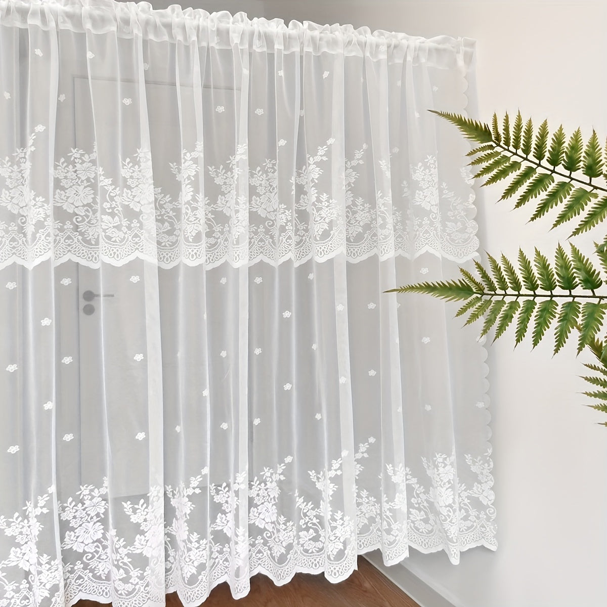 Add a touch of charm to your living space with this lovely White Floral Lace Curtain featuring a Sweet Garden Style. The Rod Pocket Design makes hanging a breeze, making it perfect for windows and doors in the living room, bedroom, or kitchen. Made of