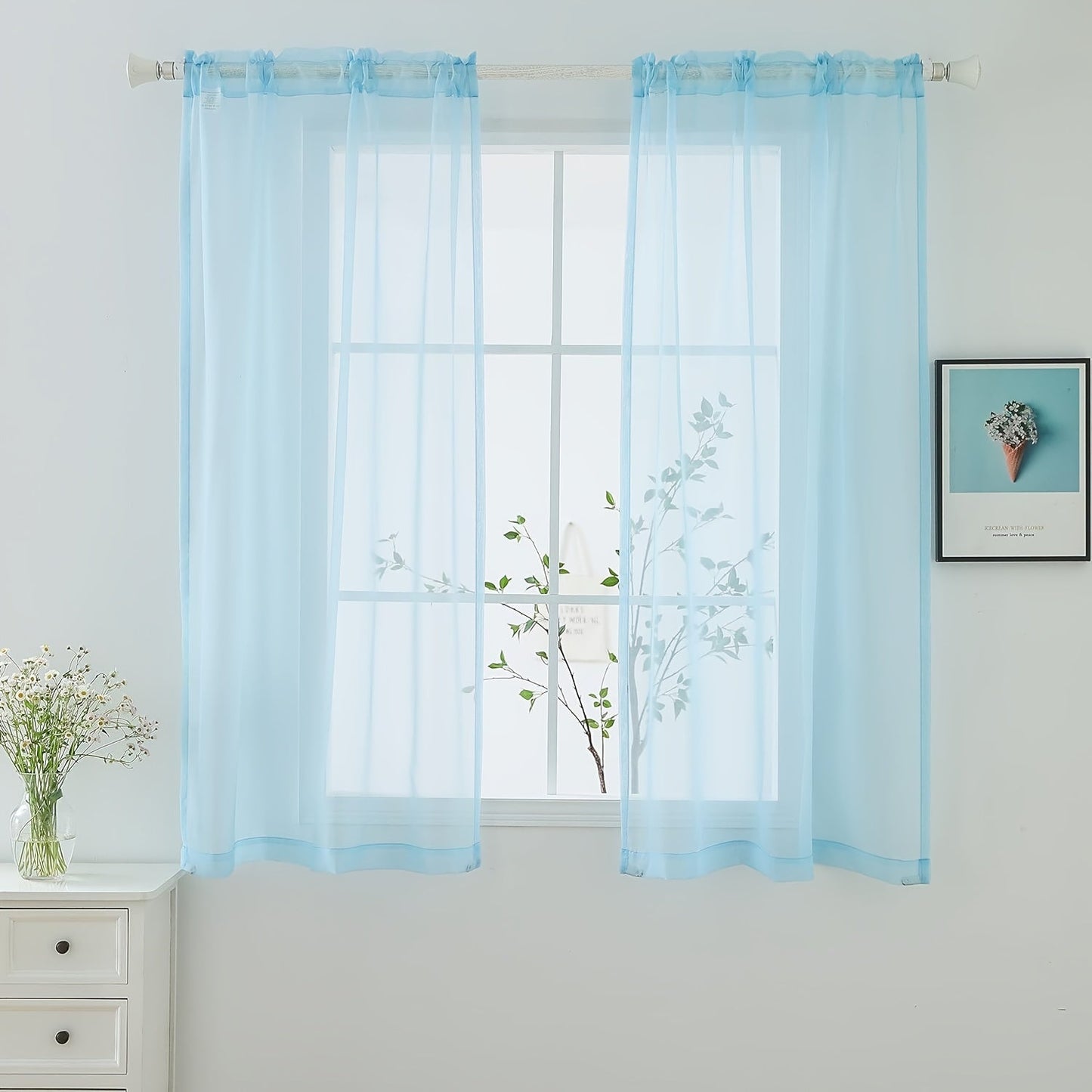 Two panels of sheer curtains with a basic rod pocket design, perfect for adding a touch of elegance to your bedroom, office, living room, yard, kitchen, or any other space in your home.