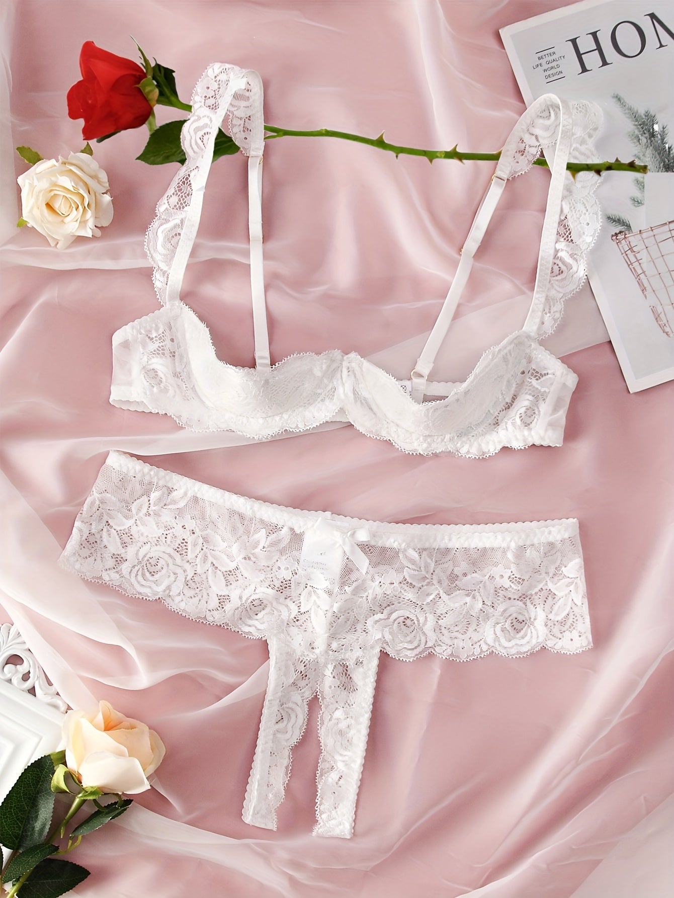 Floral lace lingerie set with open bust bra and crotchless panties for women.