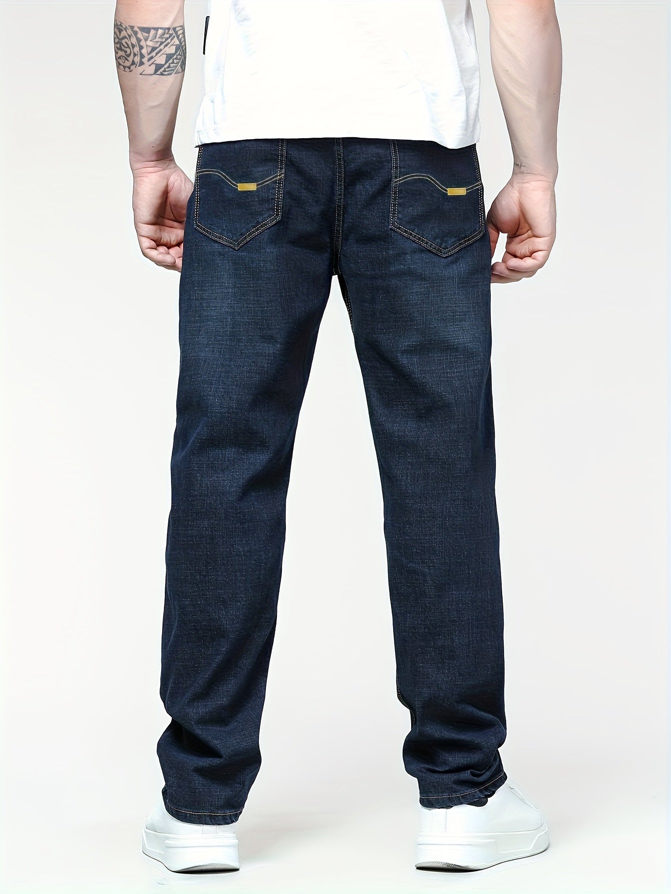 Men's solid denim pants for spring and fall in plus sizes.