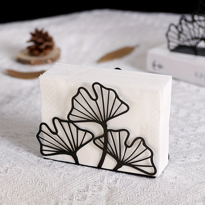 Stylish metal napkin holder with ginkgo leaf design, ideal for dining tables and kitchen decor in restaurants, hotels, and cafes.