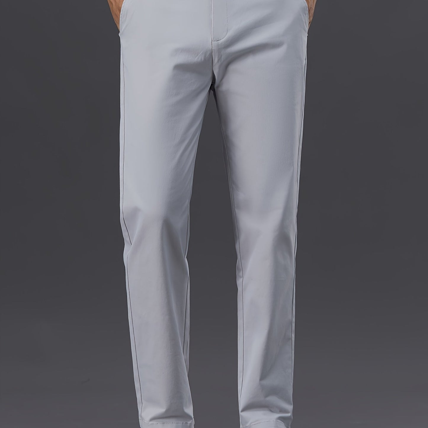 Men's slim-fit cotton blend trousers in solid color, suitable for business casual wear throughout the year. Features micro-elastic fabric, pockets, and regular length.