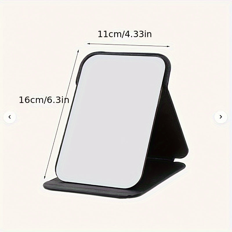 Stylish black foldable makeup mirror, great for desk, bedroom, and bathroom decor. Ideal for travel and makes a unique gift for weddings, parties, and birthdays. Glass surface with polished finish.