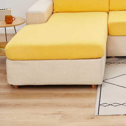 Durable sofa cover protects furniture from spills and stains.