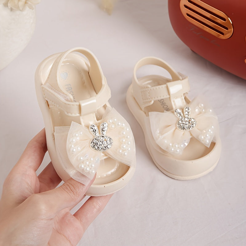 New 2024 baby girl sandals with anti-kick feature, cute rabbit design, and soft soles for beach.