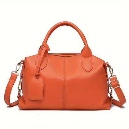 Stylish shoulder bag with removable strap and zip closure, perfect for everyday use.