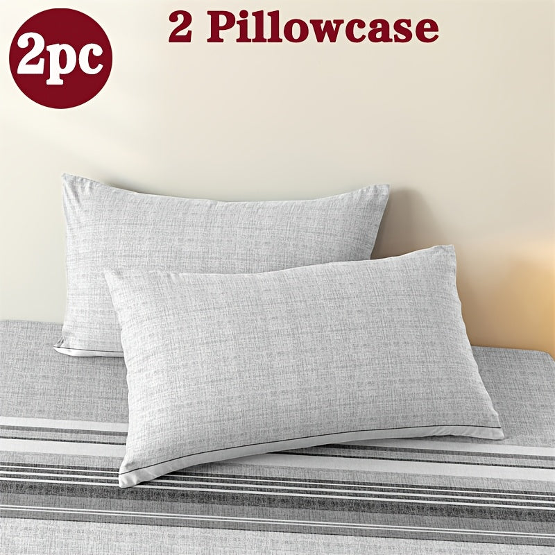 Two geometric print pillowcases made from soft and breathable polyester microfiber. These pillowcases are machine washable and feature an envelope closure for easy use. Perfect for adding a stylish touch to your home bedding, these pillowcases do not