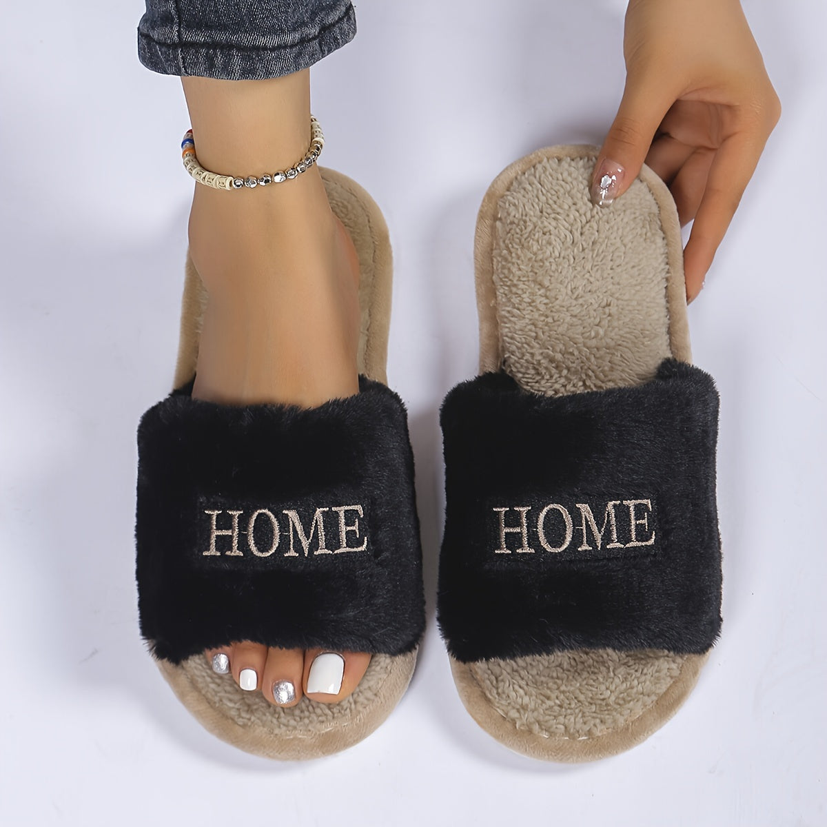 White plush slippers with "HOME" embroidery, cozy and comfortable for all seasons.