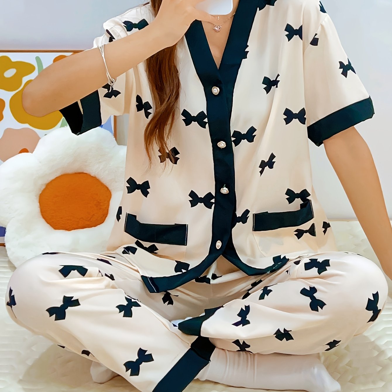 Summery short-sleeved women's pajama suit with sweet V-neck cardigan and thin material perfect for summer.