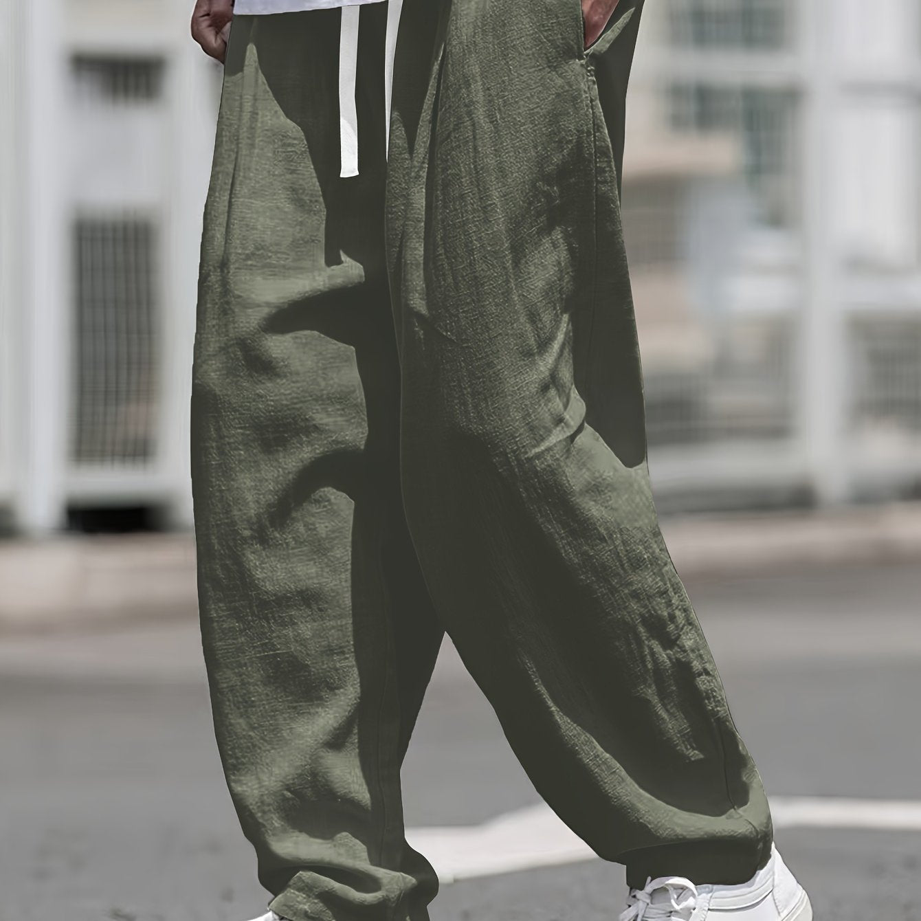 Street style drawstring trousers for men with a loose fit.