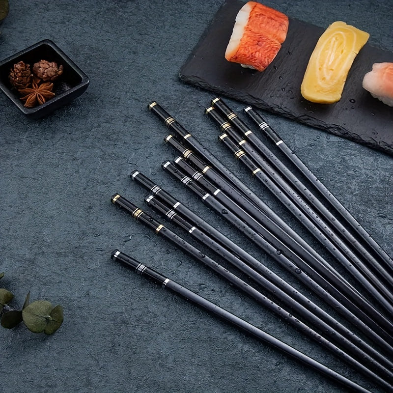 5 pairs of reusable alloy chopsticks with embossed Great Wall pattern, perfect for fast food, noodles, sushi, and ramen. Luxurious and stylish.