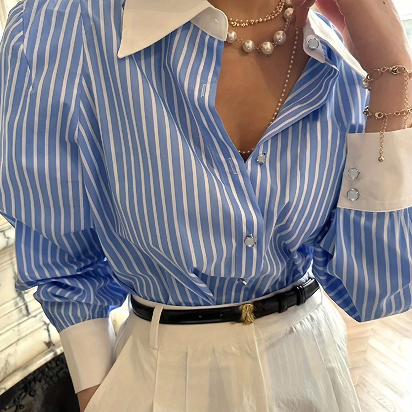 Elegant blue and white striped button-up shirt with neat collar, long sleeve, made of polyester, machine washable. Perfect for office and casual wear, ideal for New Year's celebrations.