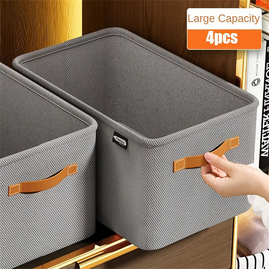 4 gray non-woven fabric storage boxes with handles for clothes and home organization; foldable and thickened for under-bed storage.