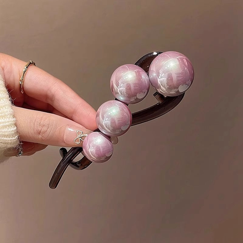 Stylish imitation pearl twist hairpin for daily wear and styling.