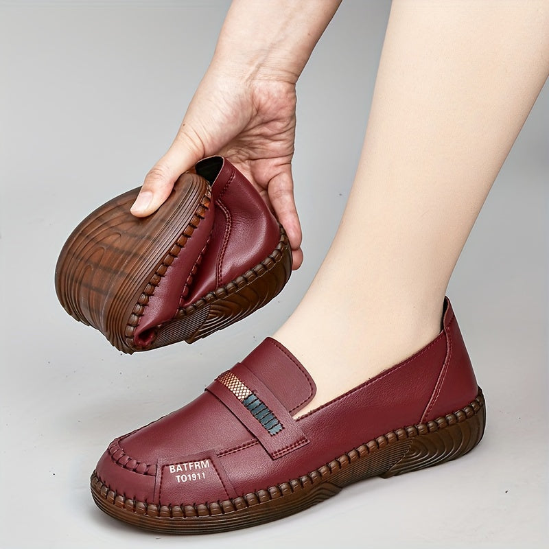 Women's comfortable round toe flat slip-on shoes for walking outdoors.