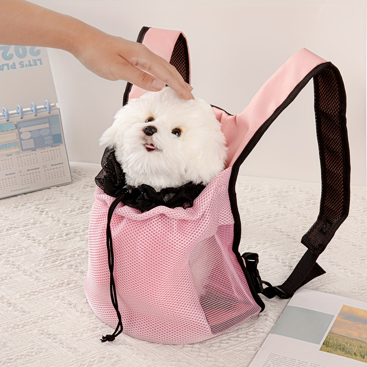 Small dog and cat backpack carrier with breathable mesh and knit fabric weaving for all-season outdoor travel. Features tether style carry method for small breed comfort.