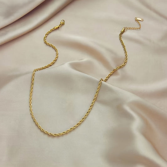 Set of two golden stainless steel twisted rope design necklace and bracelet, featuring a vintage and minimalist style. Perfect for bohemian fashion lovers, this set makes a great Mother's Day gift and can be worn for women's daily commute or as a