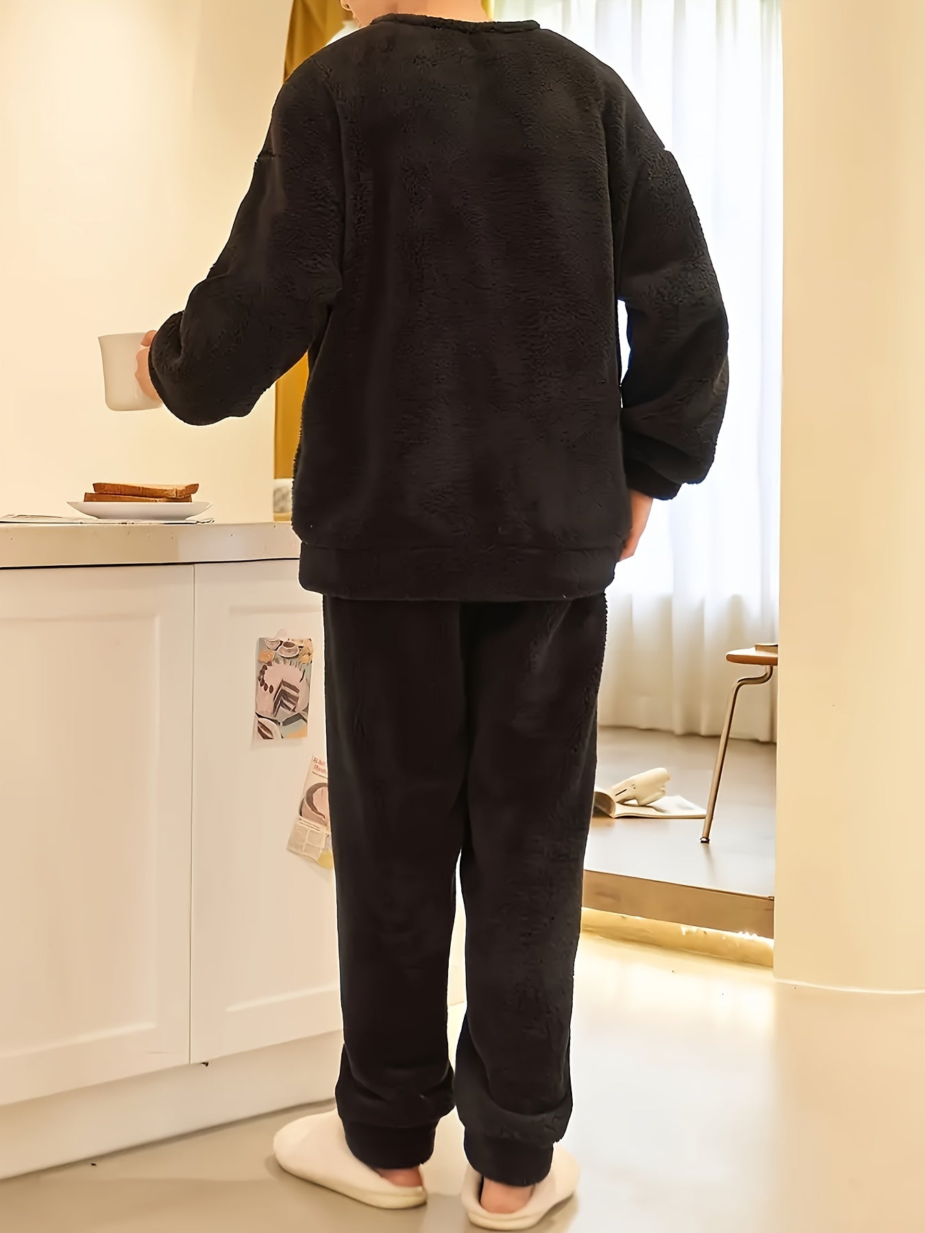 Comfy fleece pajama set for men with long sleeve top and loose-fit pants, perfect for fall/winter lounging.