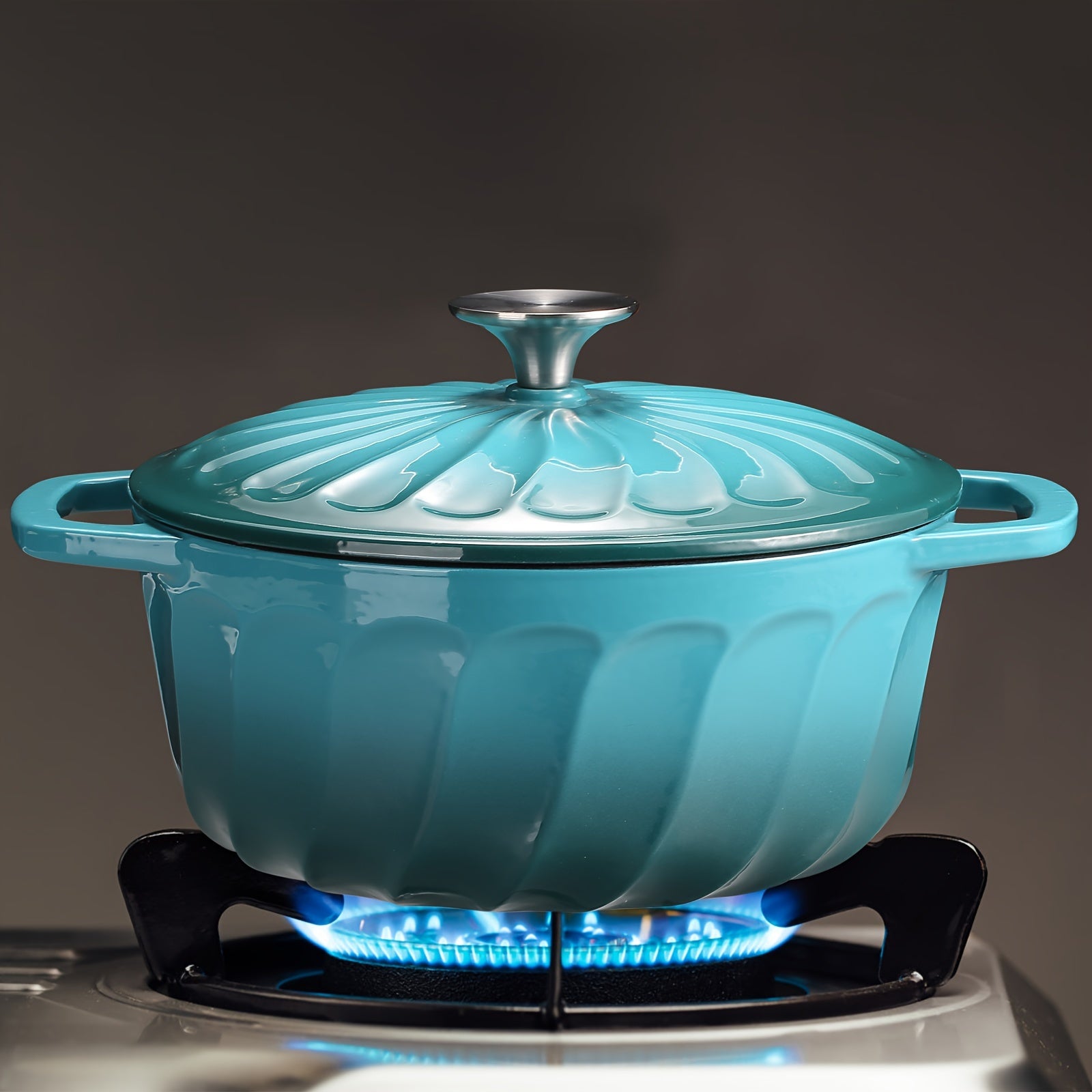 Turquoise blue enameled cast iron Dutch oven with lid, perfect for cooking on the stove or in the oven. This round casserole dish measures 28.45cm and is ideal for all your cooking needs.