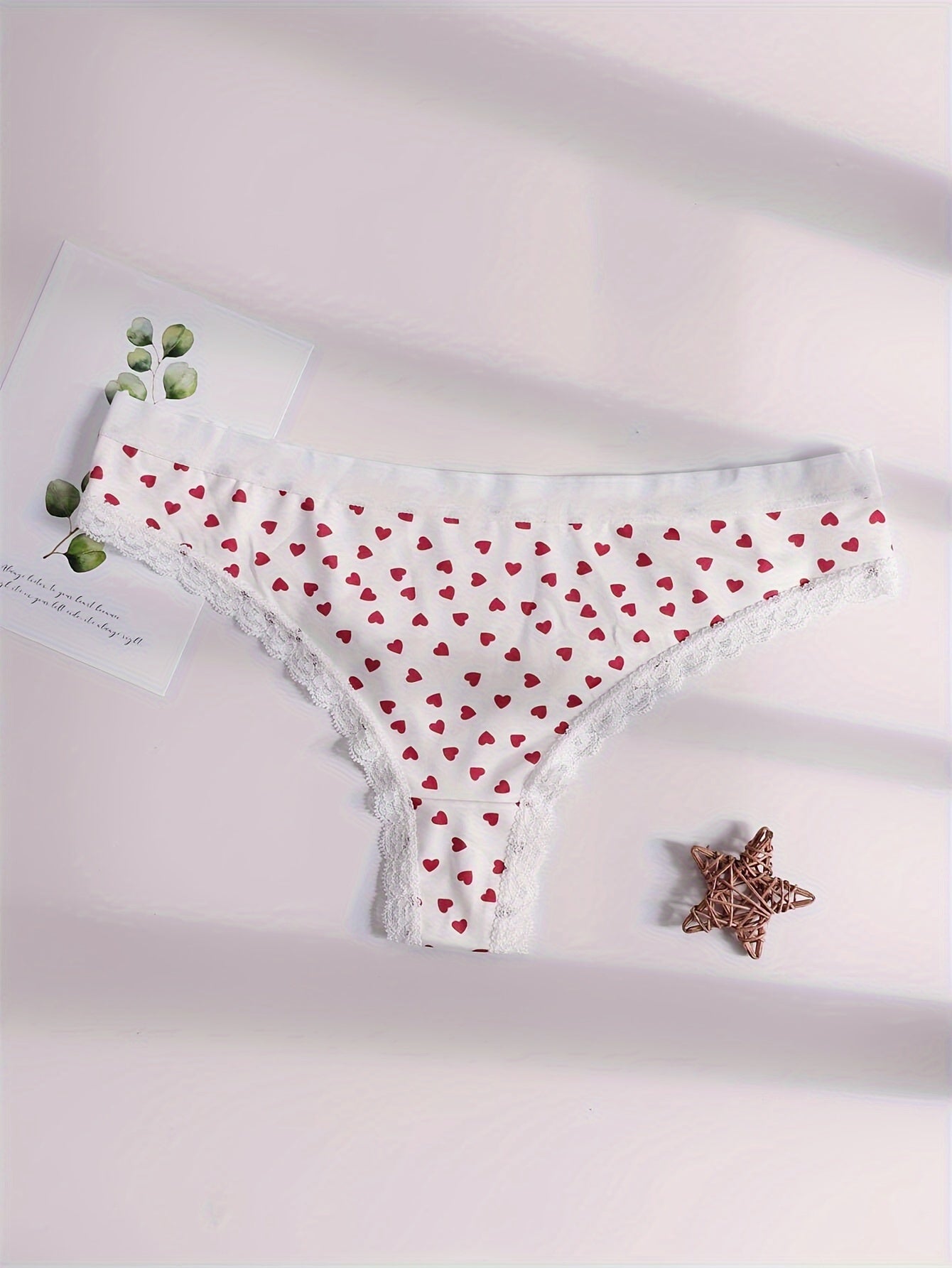 Heart print thongs with low waist lace, sexy women's underwear.