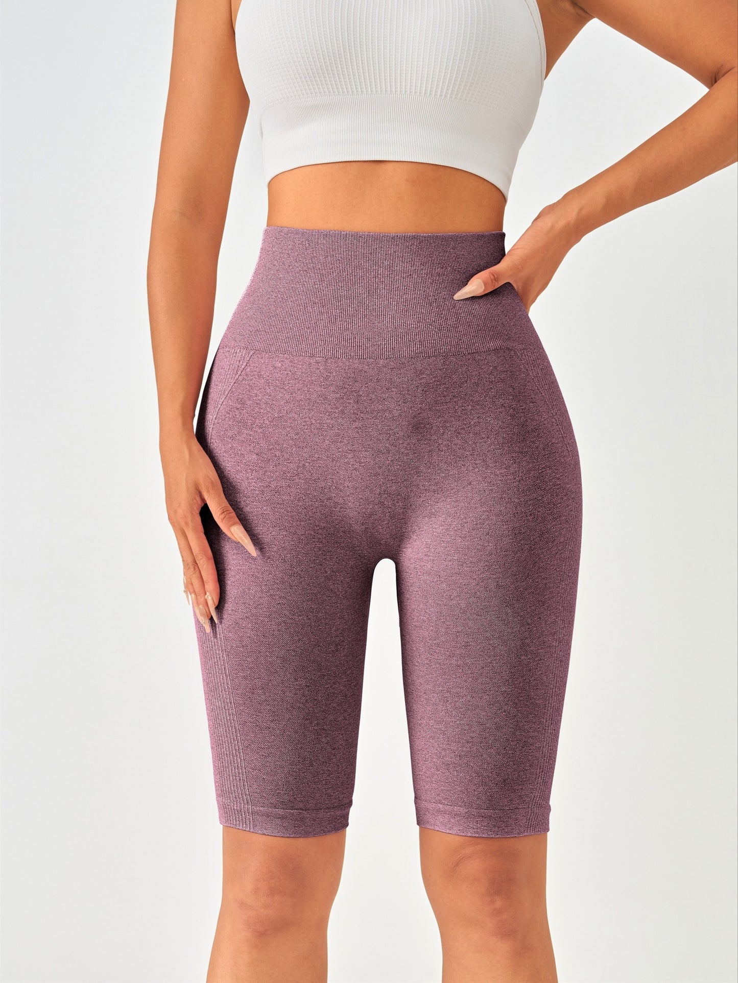 Solid color knitted yoga fitness pants for women with high waist, hip lift, and tight belly.