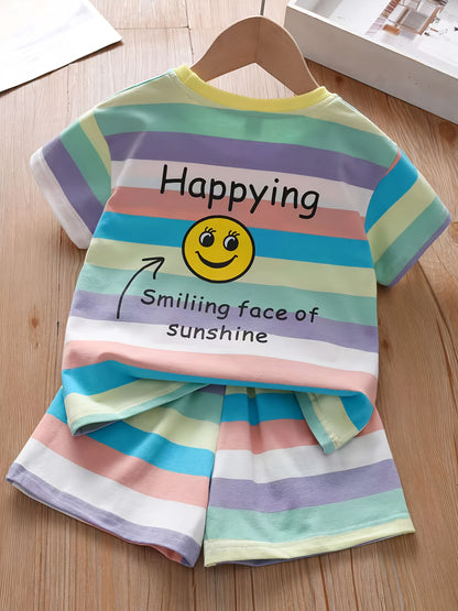 Summer fashion set for girls: Cute T-shirt with joyful face & letter print paired with striped shorts. Made of cotton blend, machine washable, ideal for outdoor activities.