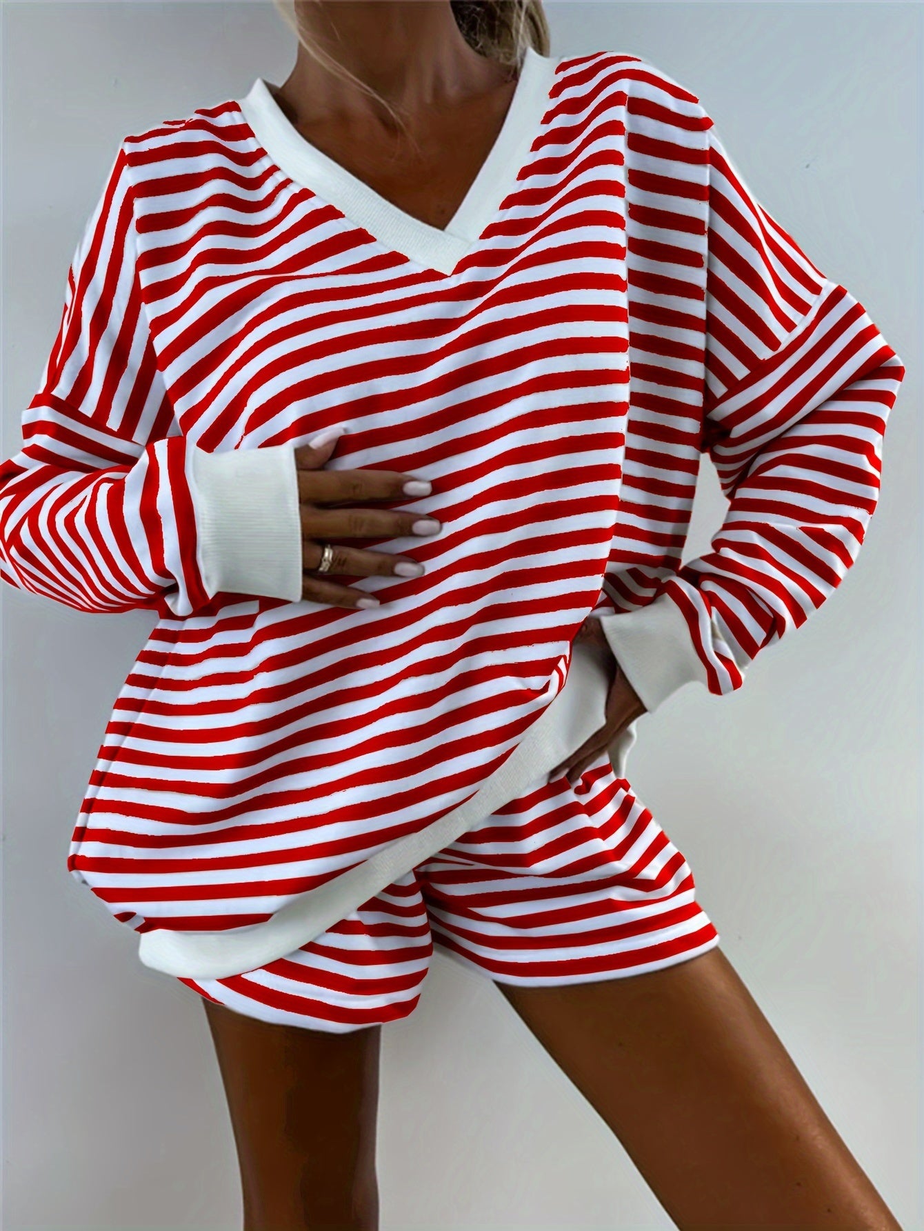 Striped lounge set for women, loose fit with long sleeve top and shorts, perfect for comfy fall wear.