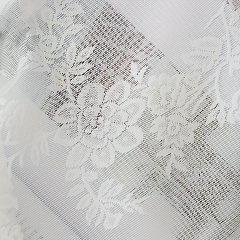 Elevate your living space with the sophisticated charm of the Elegant French White Lace Sheer Curtain featuring a delicate floral pattern. Made from semi-transparent polyester, this curtain is ideal for adding a touch of elegance and privacy to your