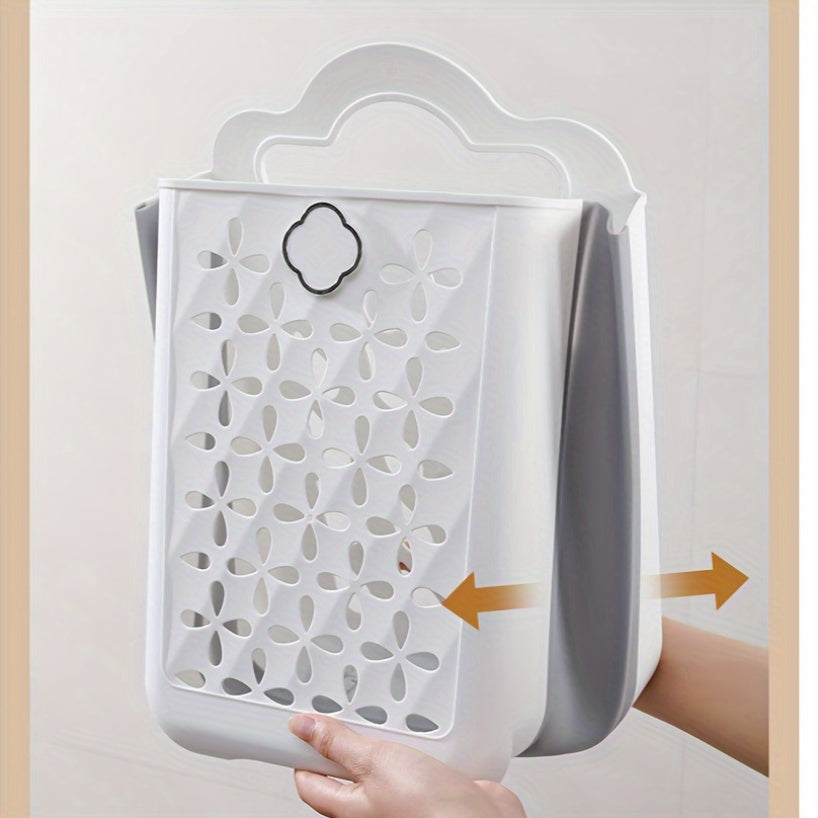 Contemporary wall-mounted laundry basket made of durable plastic with handles. Measures 39x27x19cm and is foldable for easy storage. Can be used as a bathroom organizer or multipurpose hollow bucket for toys, snacks, fruits, and vegetables. Features a