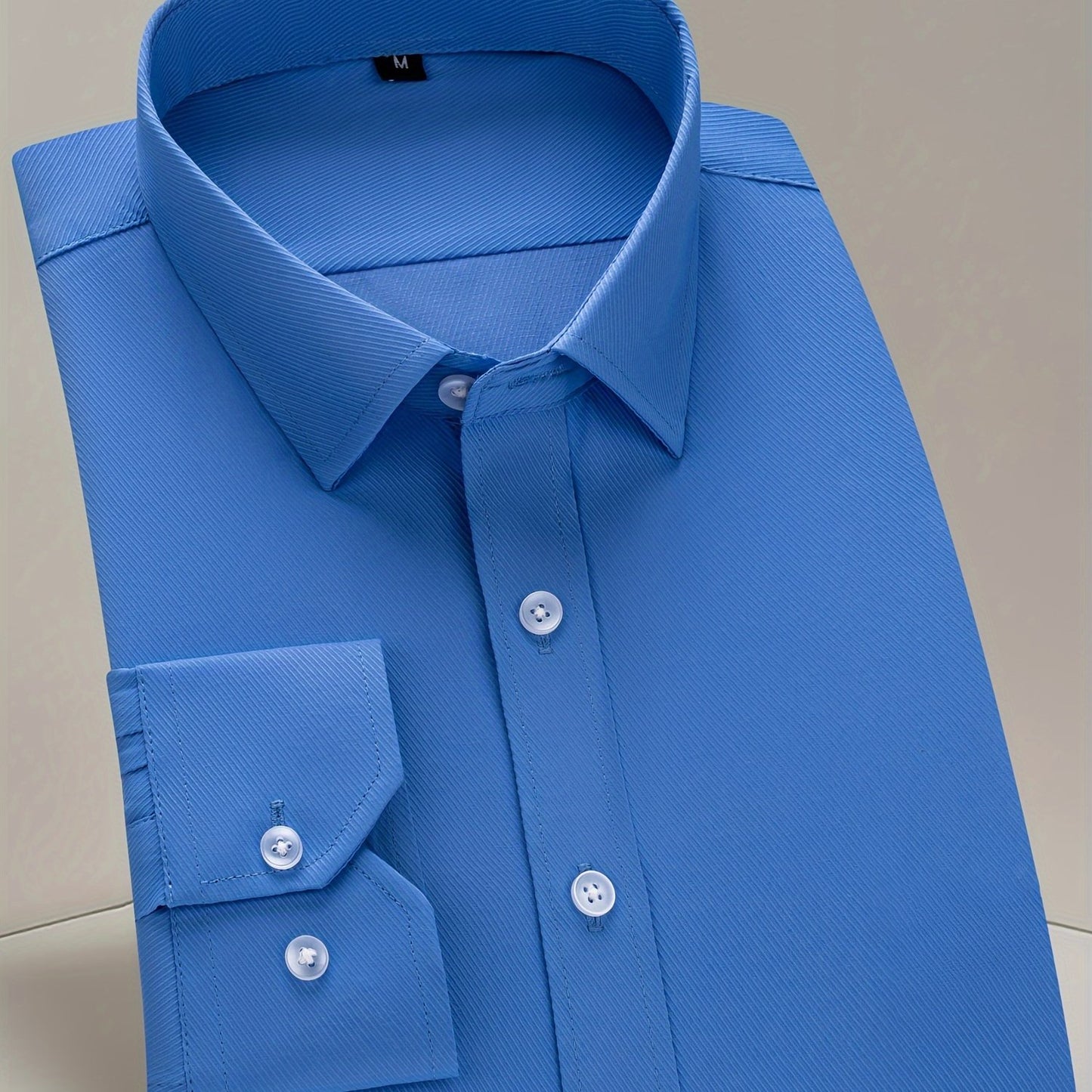 Men's classic long sleeve button up dress shirt in solid color, perfect for business and formal events.