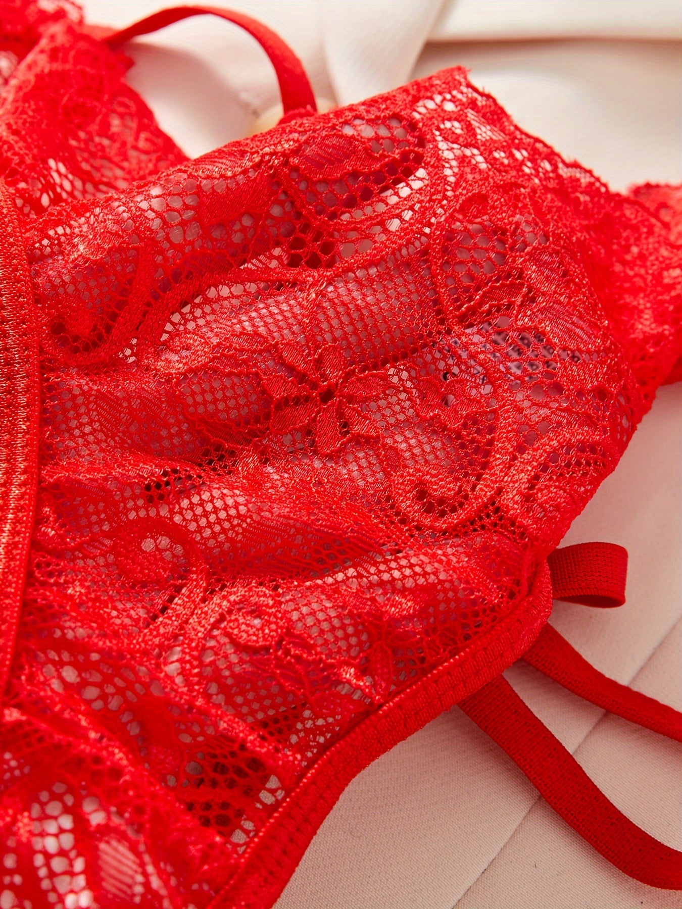 Women's low rise lace heart cut-out panties made from a breathable blend of polyester and elastane.