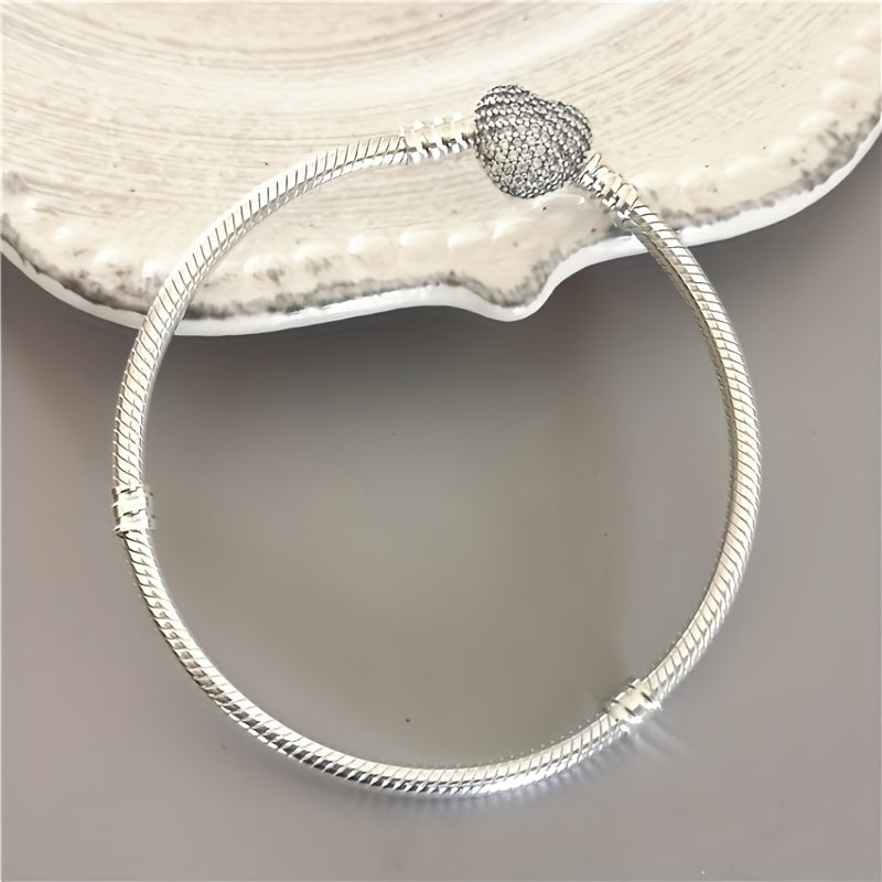 Pair of romantic couple bracelets with double-sided love zirconia lock clasps in a smooth snake pattern design, perfect for wearing to daily parties. Can be paired with a beaded pendant for a matching jewelry set, making it a great gift idea.