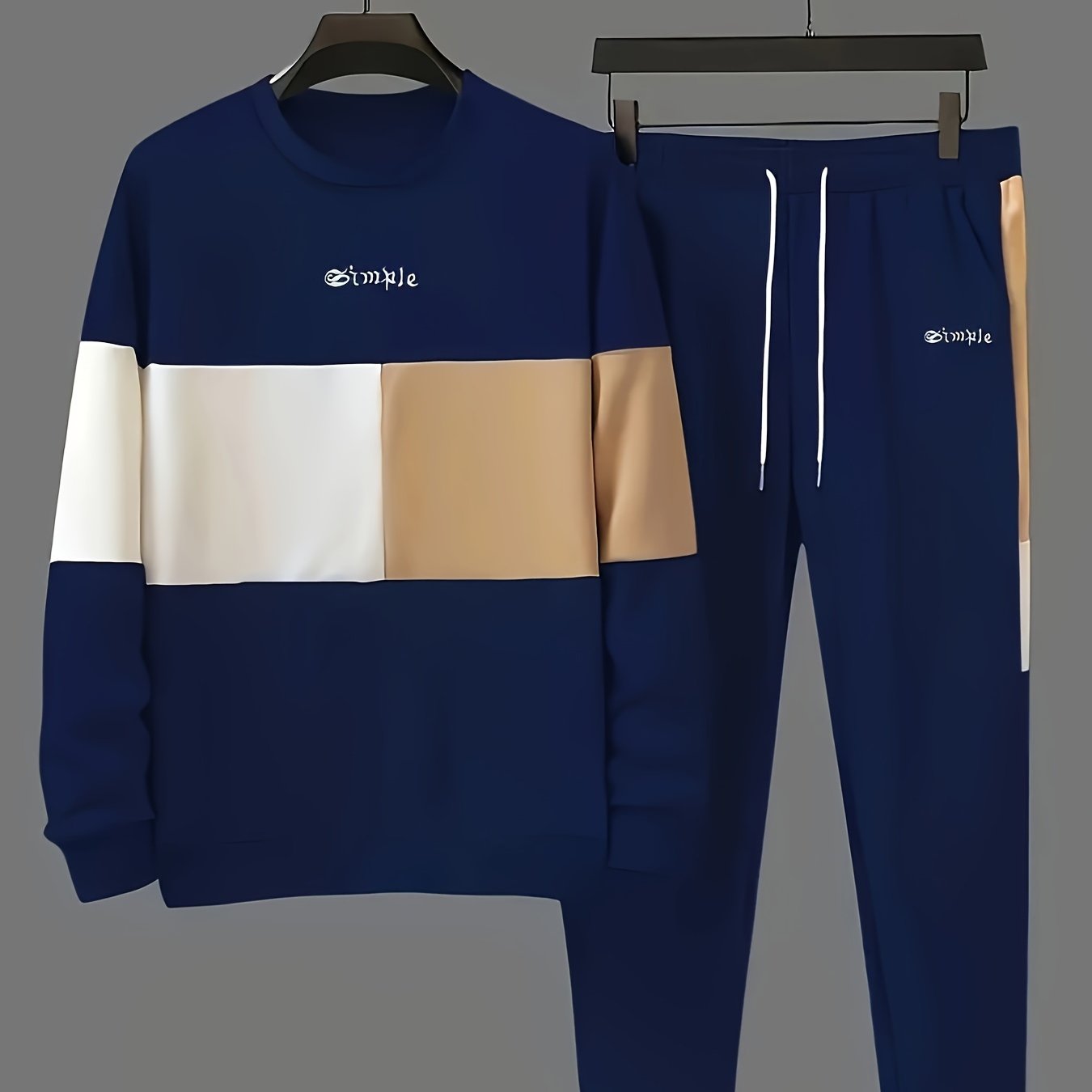 Casual men's outfit includes color block sweatshirt and drawstring pants.