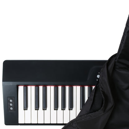 Black polyester dust cover for 88-key digital pianos with washable material, snug fit, and drawstring closure. Includes music sheet stand. Compatible with electric and digital pianos.