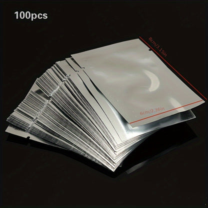 A pack of 100 small pure aluminum vacuum sealer bags in sizes 6x8cm, 7x10cm, and 8x12cm. These aluminum foil food storage pouches are made of PET material and do not require electricity.