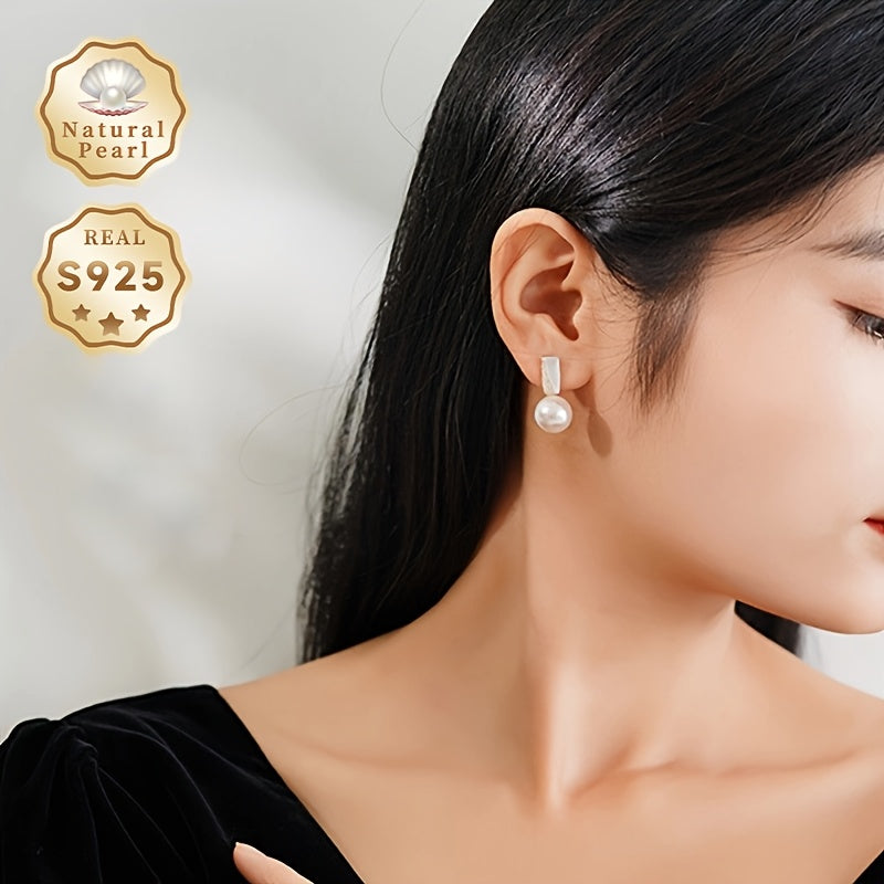 Surprise someone special with this must-have gift box containing a pair of fashionable dangling earrings for women. Made with S925 silver and featuring lustrous 11-12mm round natural freshwater pearls, each pair is unique as the natural pearls come in