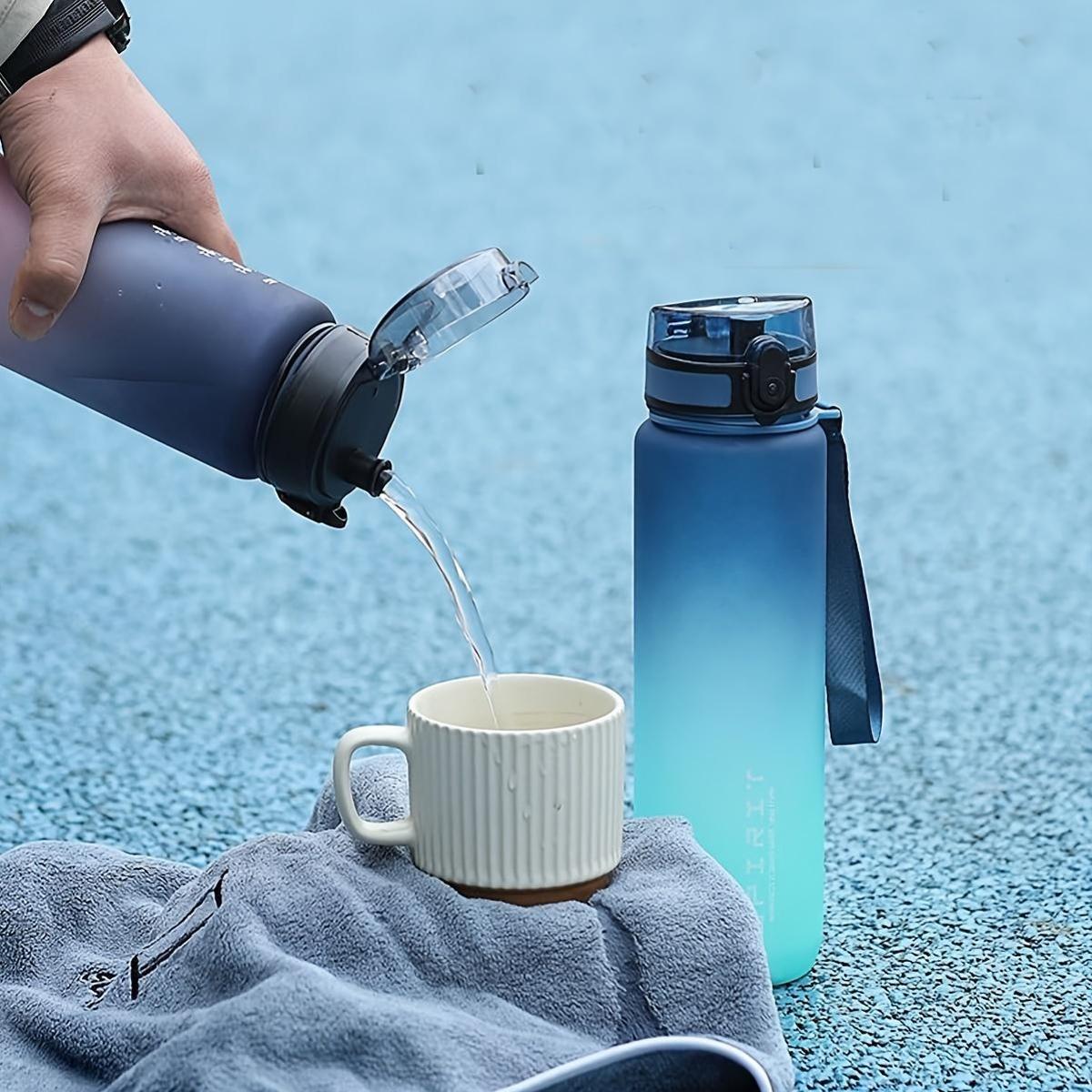 Durable frosted plastic sports water bottle with rainbow gradient, ideal for outdoor activities.