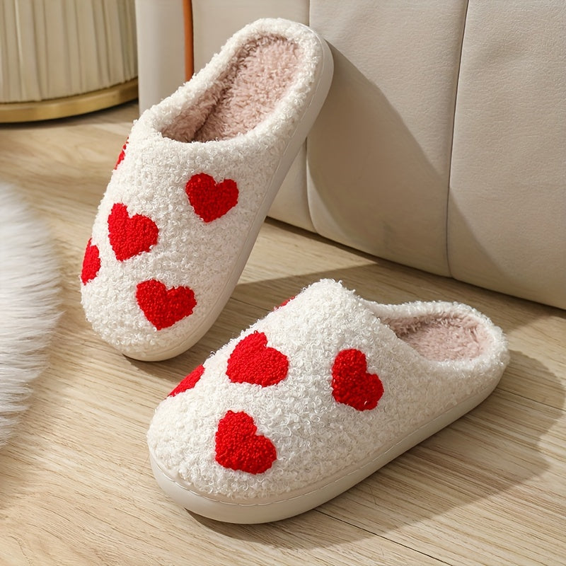 Cozy slip-on slippers with cute heart pattern, plush lining for indoor comfort.