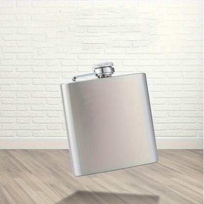 Portable stainless steel hip flask for alcohol, with screw cap and pocket-sized design for outdoor use.