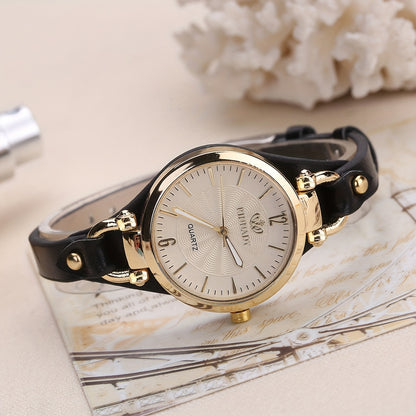 1 elegant women's quartz watch with black faux leather strap and golden-tone accents - fashionable analog display, battery operated, perfect for everyday and special occasions.