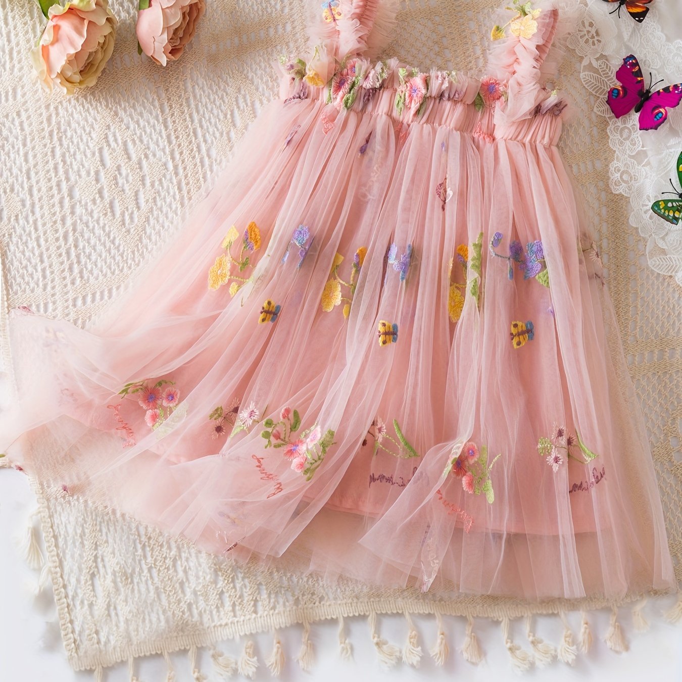 Baby's sleeveless mesh dress with elegant flower embroidery, perfect for summer birthday parties or as a gift.