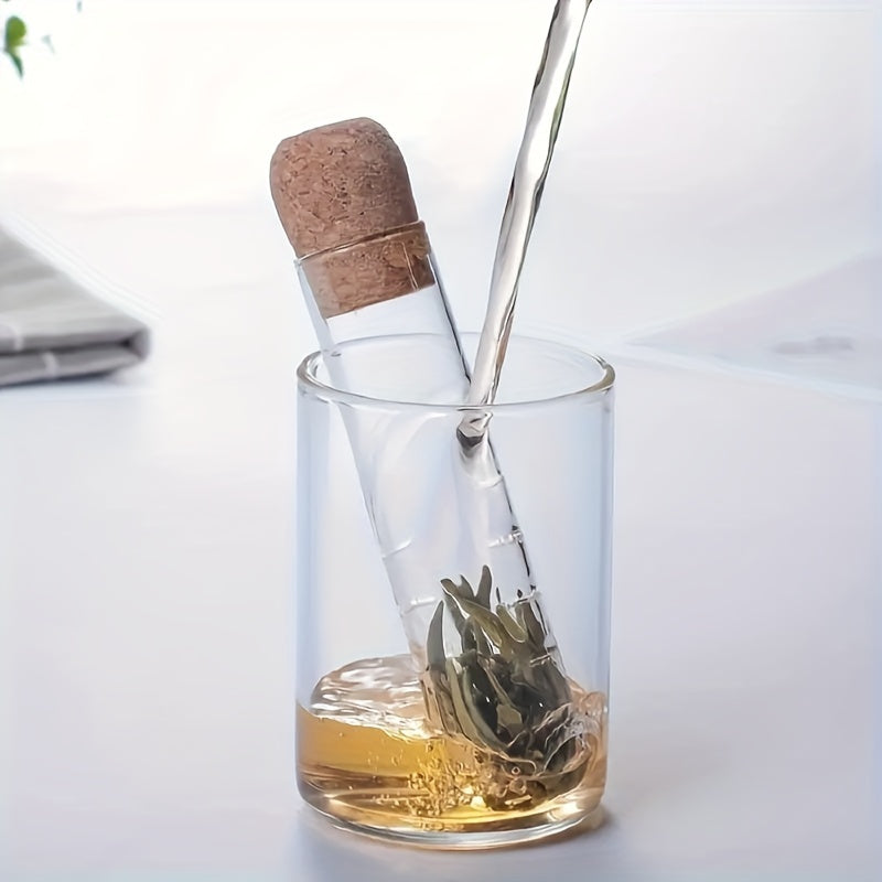 Glass tea infuser with cork lid that is easy to use and perfect for brewing loose leaf and herbal tea. Features a transparent test tube design, ideal for use in the office, camping, or home kitchen. A must-have tea accessory.