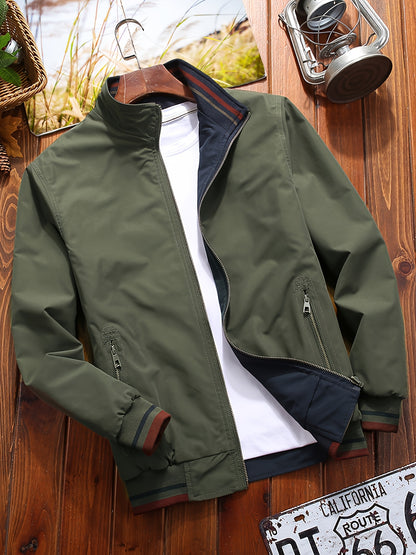 Reversible windproof jacket for men with military-inspired design, zip-up front, pockets, and long sleeves.