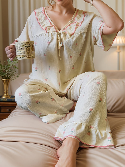 Women's printed pajama set with long pants and short sleeves in large size.