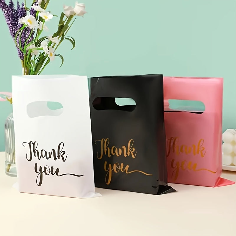 Stylish reusable plastic tote bags, ideal for retail, boutique, gifts, clothing & party favors, with elegant thank you text in black, white, and pink with golden cursive.