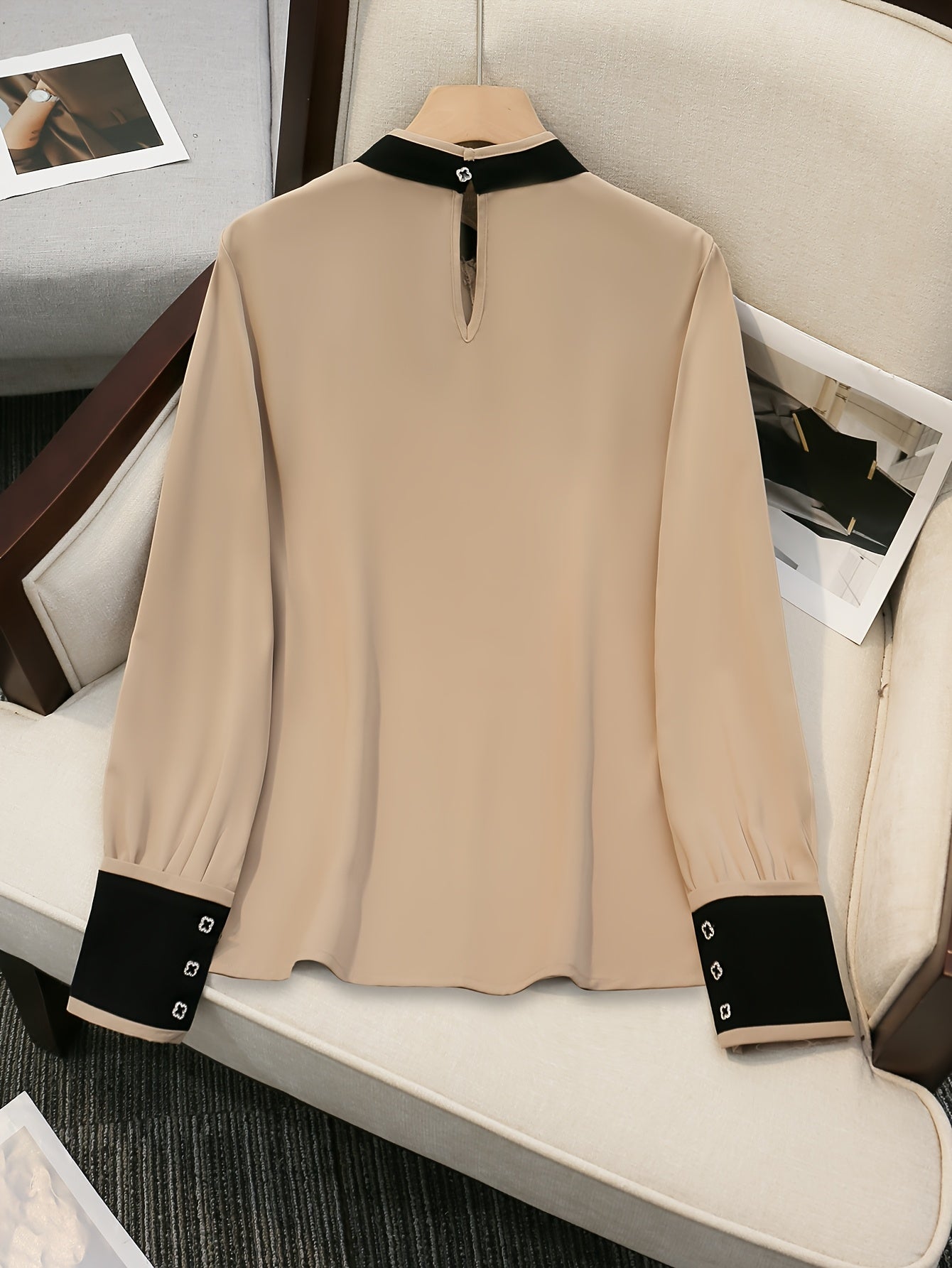 Women's beige blouse with black ruffle trim, contrast collar, long sleeve, made of polyester, machine washable, all-season chic top with tailored fit.